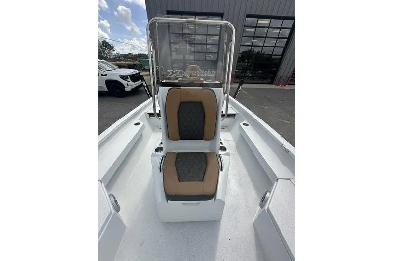 Slide: The Image of 2025 Xpress H20B Bay boat interior with dual seats and console. - 12
