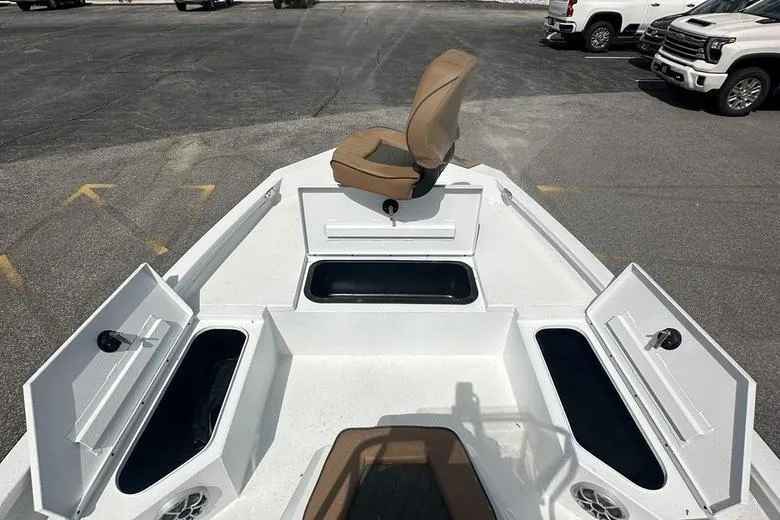 Slide: The Image of 2025 Xpress H20B Bay boat interior with storage compartments and seating. - 8