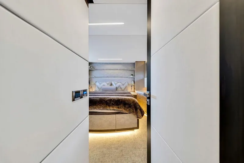 Slide: The Image of Luxurious bedroom interior on 2020 Hargrave C92 yacht, featuring modern design and ambient lighting. - 105