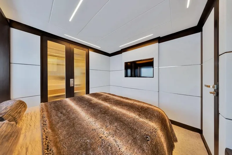 Slide: The Image of Luxurious bedroom interior on 2020 Hargrave C92 yacht with modern design and plush bedding. - 127