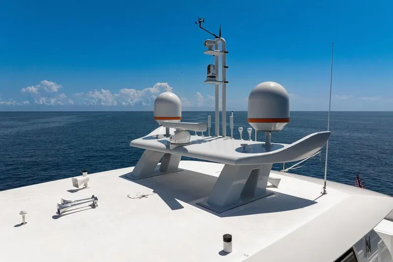 Slide: The Image of Rooftop view of 2020 Hargrave C92 yacht with radar equipment against ocean backdrop. - 16