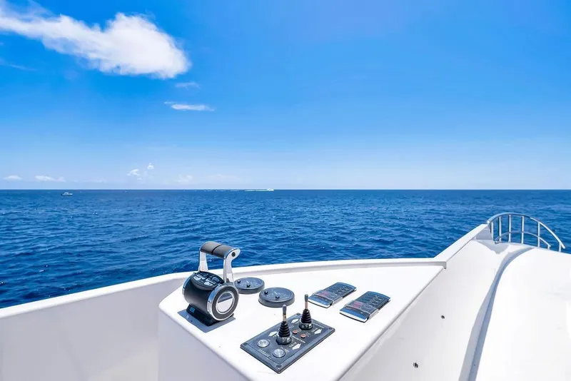Slide: The Image of Control panel on Hargrave C92 yacht, 2020, overlooking vast ocean under clear blue sky. - 37