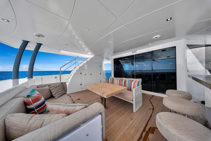 Slide: The Image of Luxurious 2020 Hargrave C92 yacht deck with modern seating and ocean view. - 48