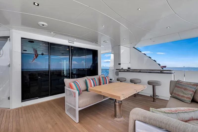 Slide: The Image of Luxurious 2020 Hargrave C92 yacht deck with seating, table, and ocean view. - 50