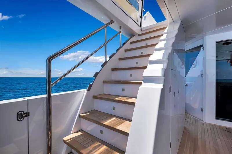 Slide: The Image of Staircase on 2020 Hargrave C92 yacht with ocean view and clear blue sky. - 51