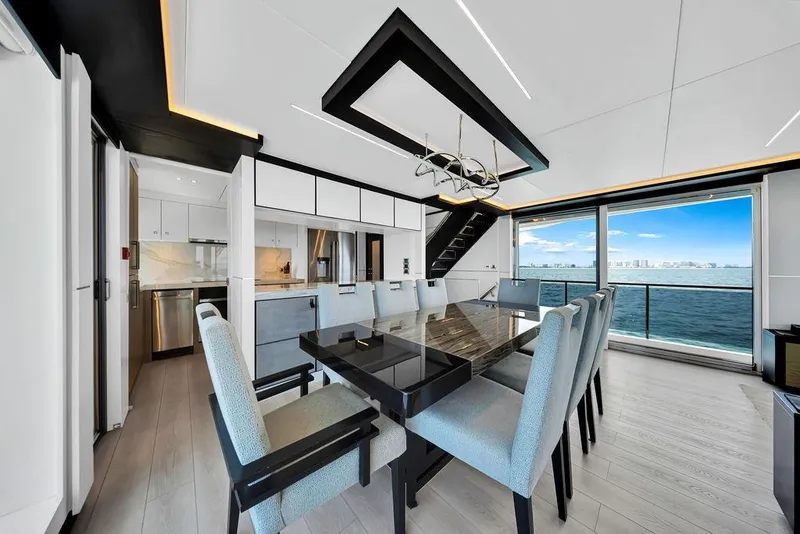 Slide: The Image of Luxurious 2020 Hargrave C92 yacht interior with elegant dining area and ocean view. - 67