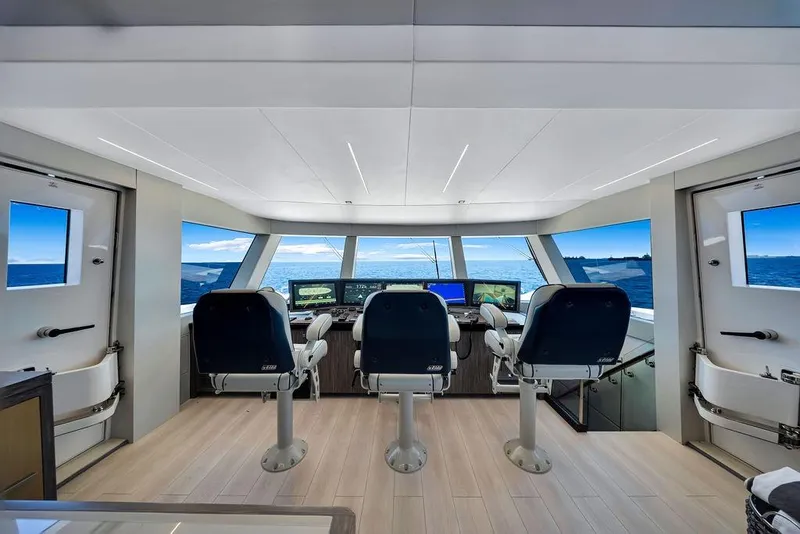 Slide: The Image of Pilothouse interior of 2020 Hargrave C92 yacht with ocean view through large windows. - 83