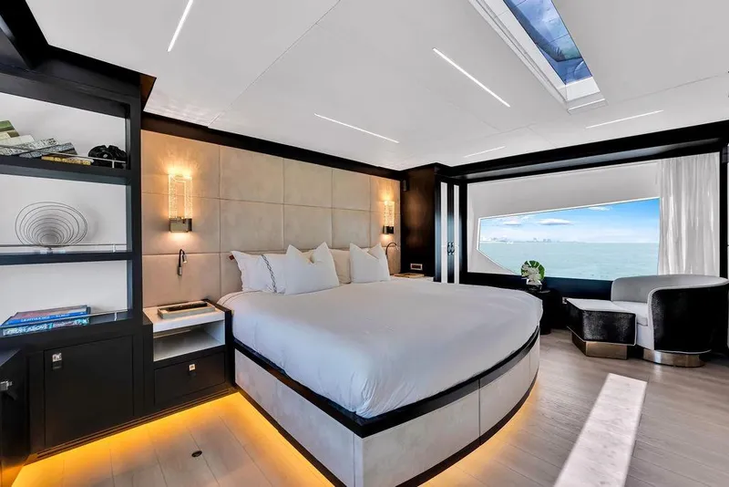 Slide: The Image of Luxurious 2020 Hargrave C92 yacht bedroom with ocean view, modern design, and elegant furnishings. - 93