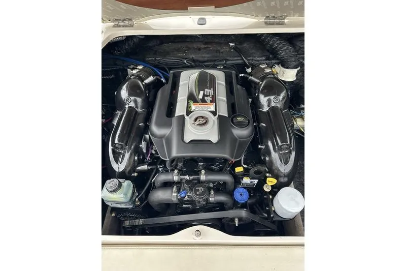 Slide: The Image of 2015 Stingray 208 LR engine compartment showcasing a powerful, well-maintained motor. - 11