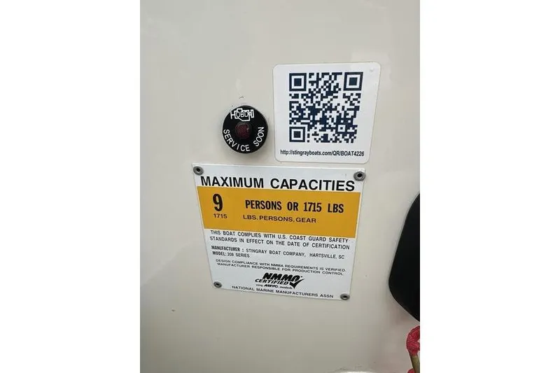Slide: The Image of 2015 Stingray 208 LR capacity label: 9 persons or 1715 lbs, QR code included. - 3