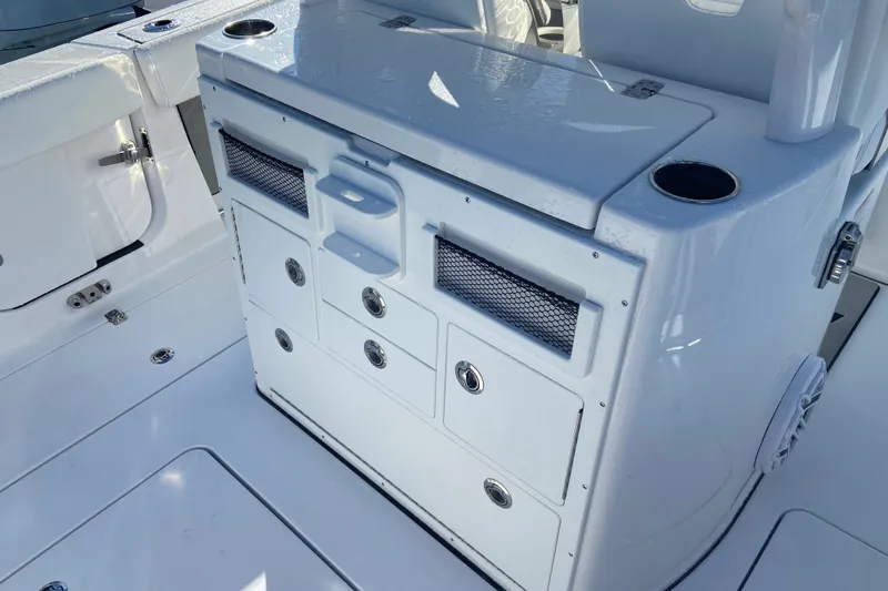 Slide: The Image of 2026 Sportsman Open 282 Center Console boat interior with storage compartments. - 6