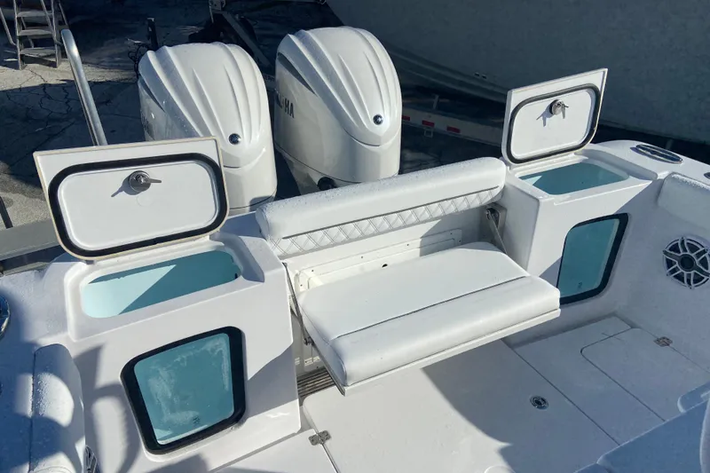 Slide: The Image of 2026 Sportsman Open 282 Center Console boat with dual engines and seating area. - 5