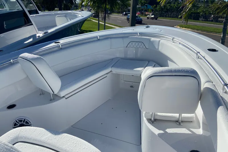 Slide: The Image of 2026 Sportsman Open 282 Center Console boat interior with seating and wet surfaces. - 17