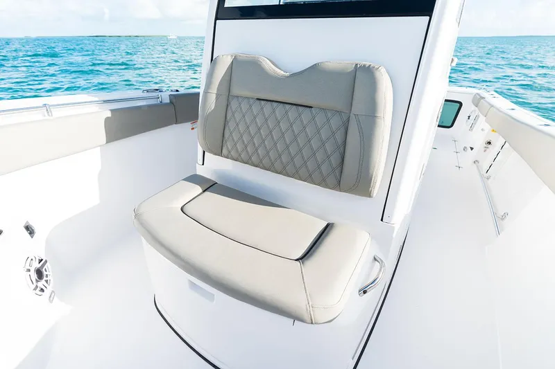 Slide: The Image of Manufacturer Provided Image: 2025 Sportsman Open 282 Center Console boat seating with ocean backdrop. - 7