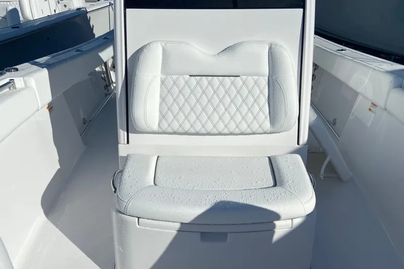 Slide: The Image of 2026 Sportsman Open 282 Center Console boat seat with diamond-pattern upholstery. - 19