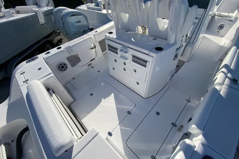 Slide: The Image of 2026 Sportsman Open 282 Center Console boat interior with seating and storage compartments. - 3