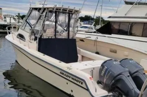 The Image of 2005 Grady-White Sailfish 282 boat docked with twin outboard motors. - 0