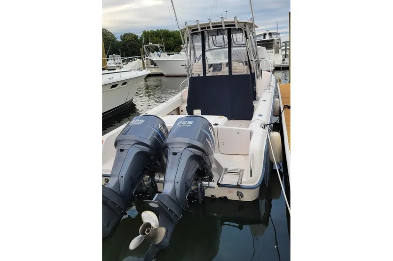 Slide: The Image of 2005 Grady-White Sailfish 282 boat with twin Yamaha 225 engines docked at marina. - 3