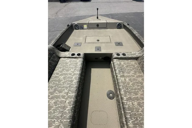 Slide: The Image of 2026 SeaArk EasyCat boat interior with camouflage seating and storage compartments. - 16