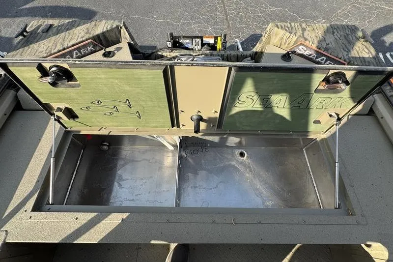 Slide: The Image of Open storage compartment of 2026 SeaArk EasyCat boat, showcasing interior details and branding. - 3