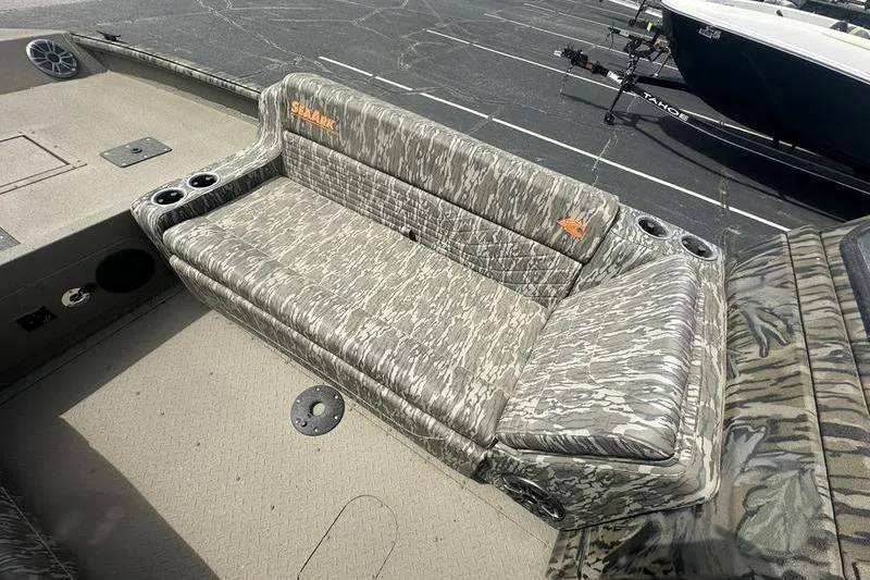 Slide: The Image of 2026 SeaArk EasyCat boat with camouflage seating and cup holders on deck. - 7
