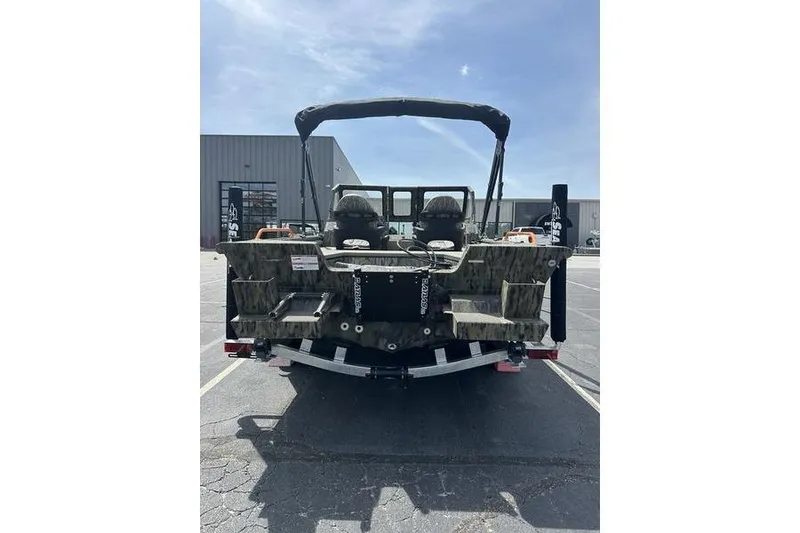 Slide: The Image of 2026 SeaArk EasyCat boat with camouflage design, parked outdoors under a clear sky. - 9