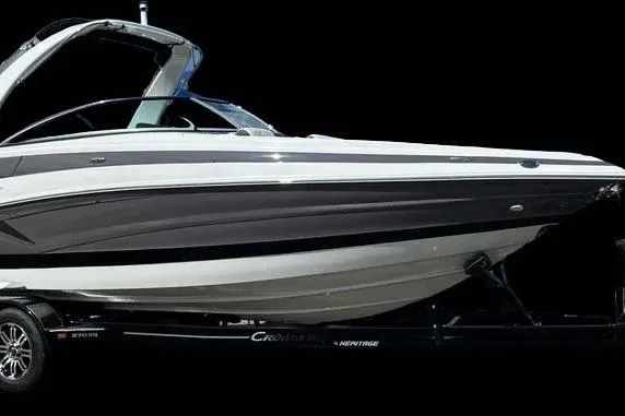 The Image of 2026 Crownline 270 SS boat on trailer, sleek design, black background. - 0