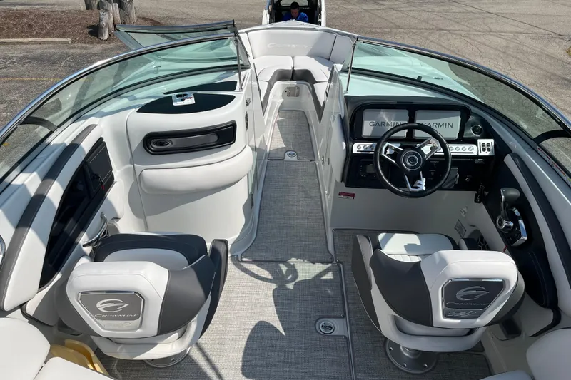 Slide: The Image of Interior of a 2026 Crownline 270 SS boat, featuring modern seating and a sleek dashboard. - 13