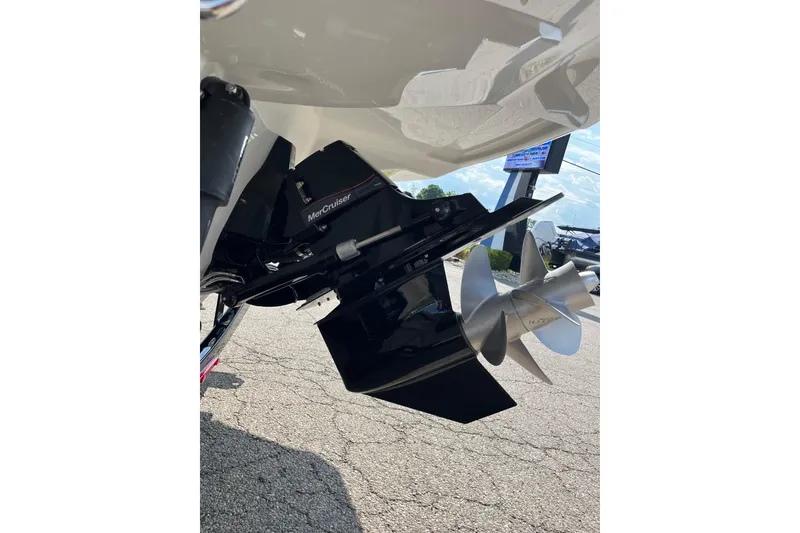 Slide: The Image of 2026 Crownline 270 SS boat with MerCruiser propeller system, displayed outdoors. - 3