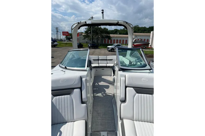 Slide: The Image of 2026 Crownline 270 SS boat interior with white seating and open cockpit design. - 4