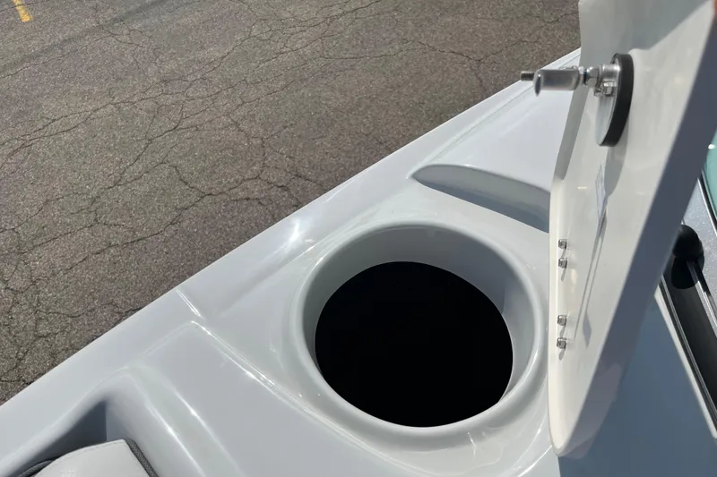 Slide: The Image of Open storage compartment on 2026 Crownline 270 SS boat, showcasing sleek design. - 6