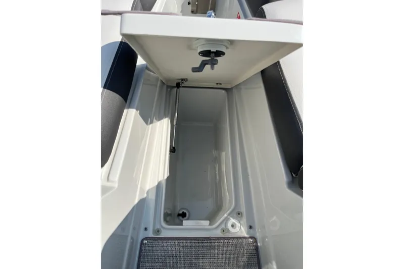 Slide: The Image of Open storage compartment in 2026 Crownline 270 SS boat, showcasing interior space. - 7