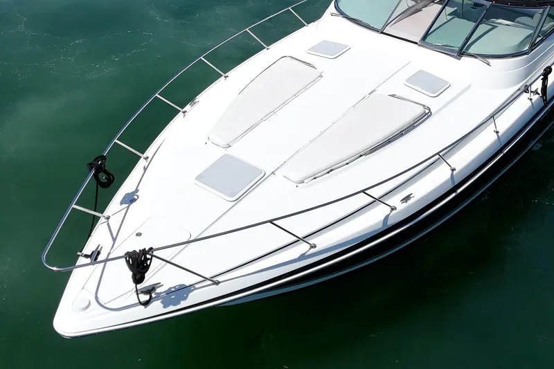 Slide: The Image of 2005 Formula 40 Performance Cruiser, sleek white deck, cruising on calm green waters. - 10