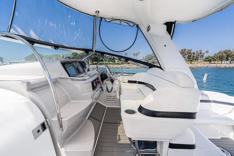 Slide: The Image of Interior view of a 2005 Formula 40 Performance Cruiser, featuring sleek white seating and modern controls. - 23