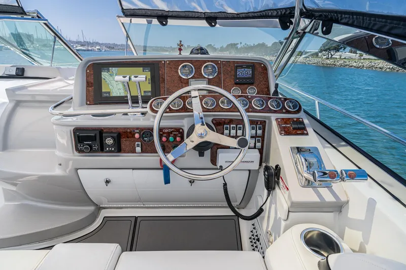 Slide: The Image of Cockpit of 2005 Formula 40 Performance Cruiser with navigation instruments and steering wheel. - 24