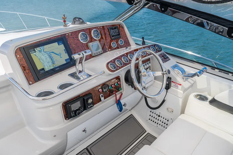 Slide: The Image of Helm of 2005 Formula 40 Performance Cruiser with navigation system and controls. - 25