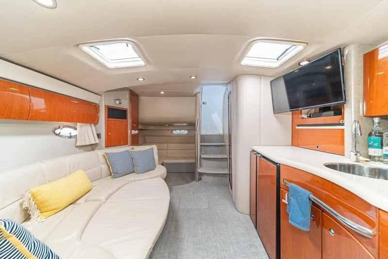 Slide: The Image of Luxurious interior of a 2005 Formula 40 Performance Cruiser with modern amenities and elegant design. - 32