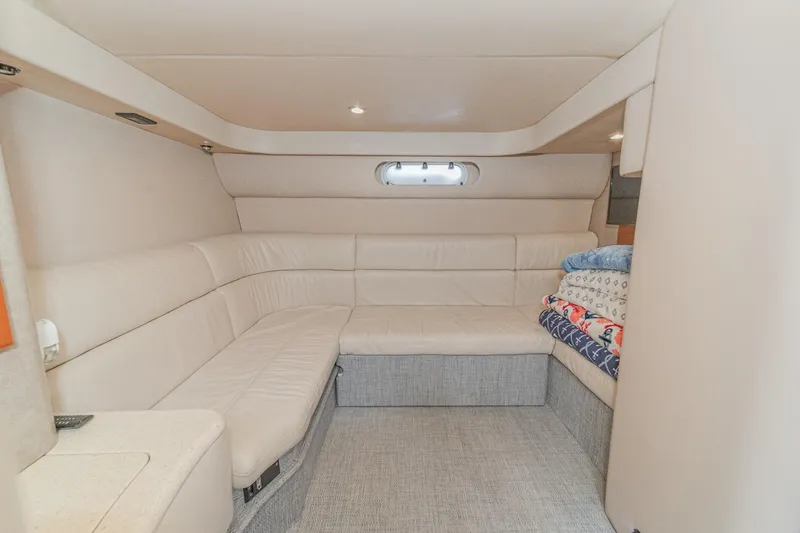 Slide: The Image of Interior of 2005 Formula 40 Performance Cruiser with beige seating and stacked blankets. - 37