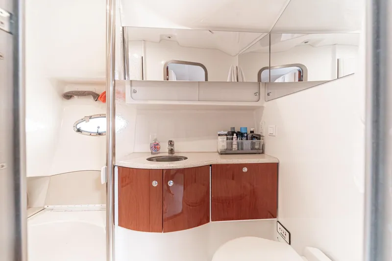Slide: The Image of Luxurious bathroom in 2005 Formula 40 Performance Cruiser with modern fixtures and wooden cabinetry. - 41