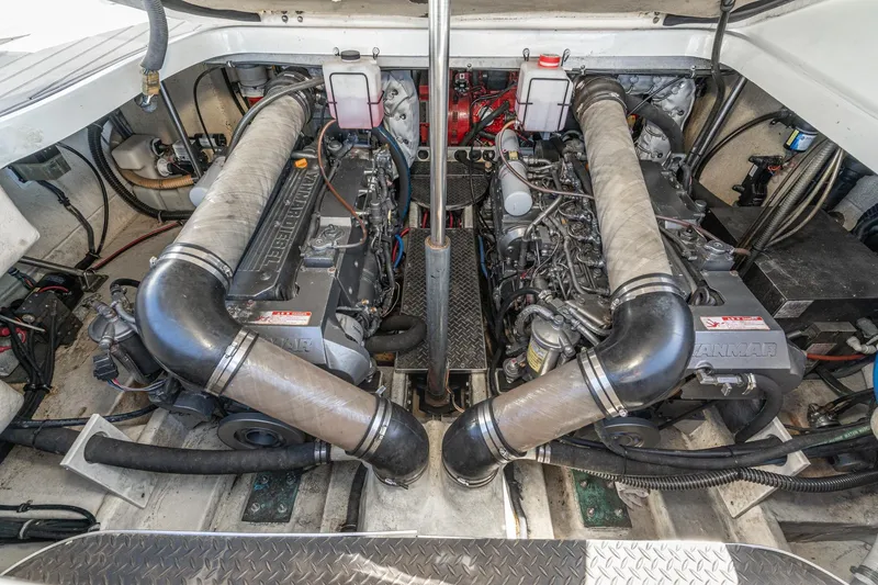 Slide: The Image of Engine compartment of a 2005 Formula 40 Performance Cruiser, showcasing dual Yanmar diesel engines. - 44