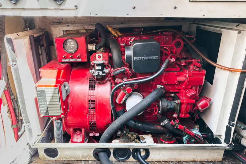 Slide: The Image of Engine compartment of a 2005 Formula 40 Performance Cruiser, featuring a red Westerbeke generator. - 47