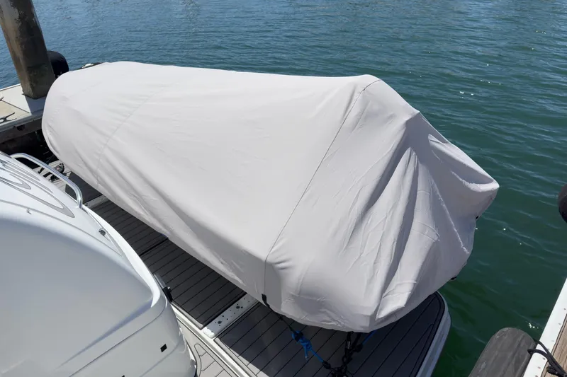 Slide: The Image of Covered 2005 Formula 40 Performance Cruiser docked by the water. - 49