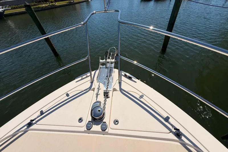 Slide: The Image of Bow view of 2022 Sabre 38 Salon Express yacht, featuring anchor and railing. - 10