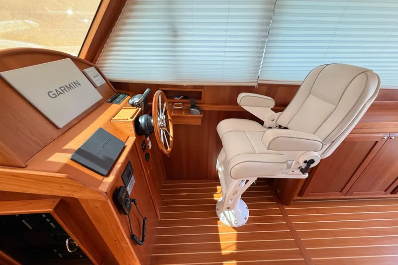 Slide: The Image of 2022 Sabre 38 Salon Express helm with Garmin navigation and luxurious captain's chair. - 22