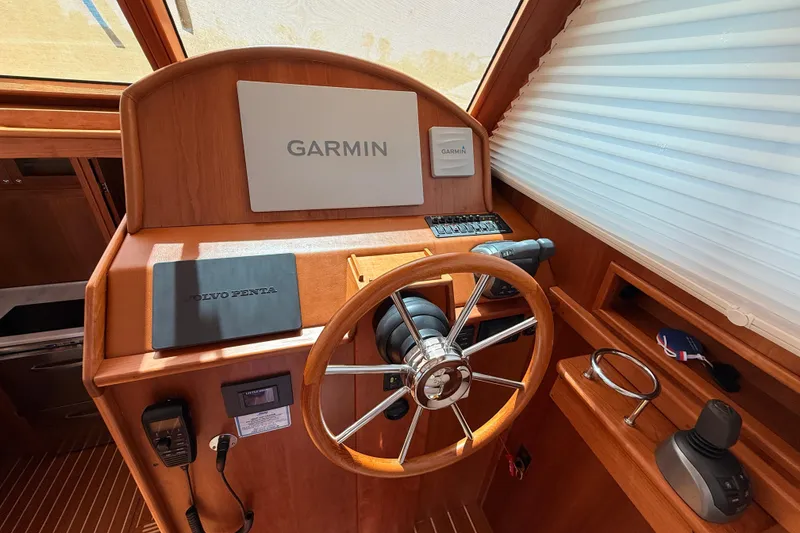 Slide: The Image of Helm of 2022 Sabre 38 Salon Express with Garmin navigation and Volvo Penta controls. - 23