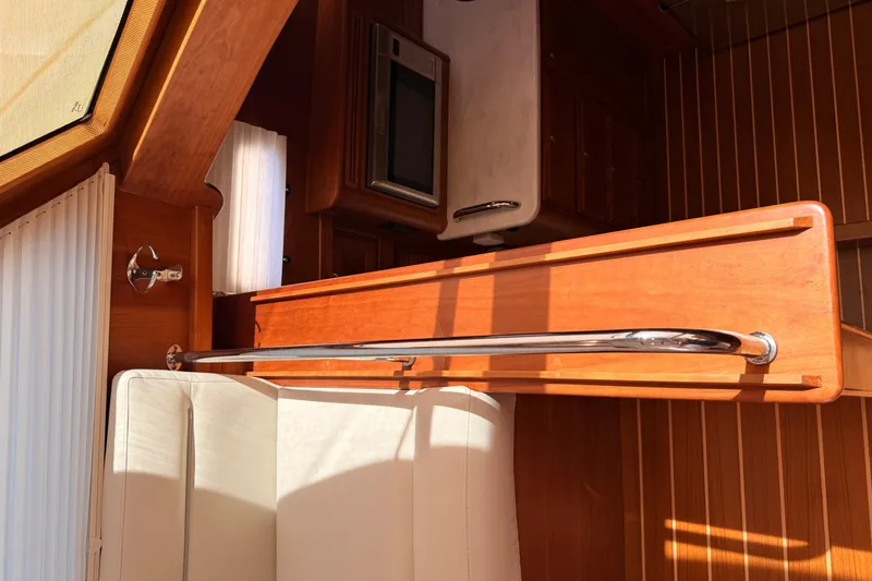 Slide: The Image of Interior of 2022 Sabre 38 Salon Express yacht with wood paneling and modern design. - 28