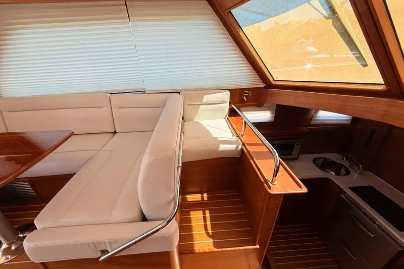Slide: The Image of Interior of 2022 Sabre 38 Salon Express yacht with elegant seating and kitchen area. - 29