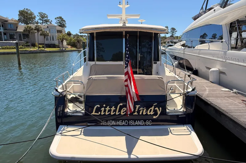 Slide: The Image of 2022 Sabre 38 Salon Express docked, featuring "Little Indy" name and American flag. - 3