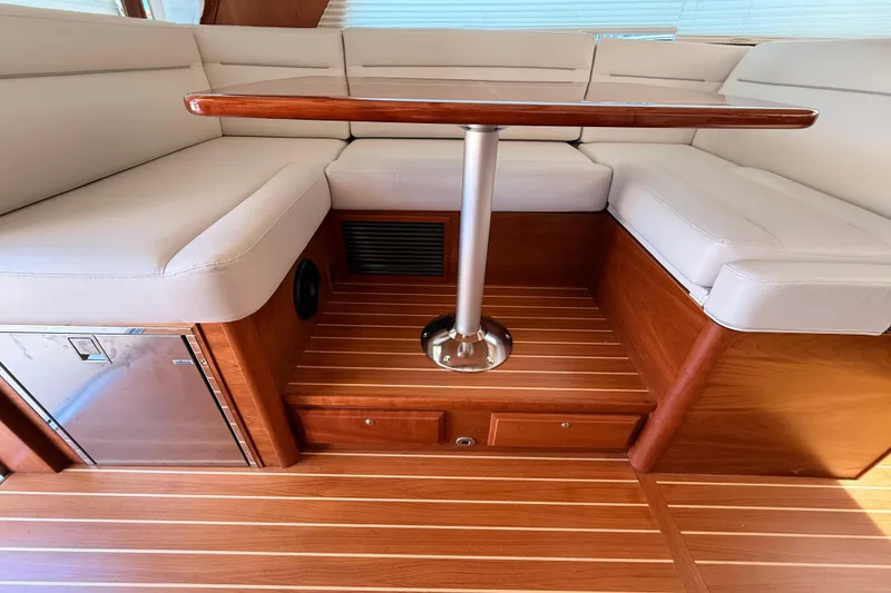 Slide: The Image of Interior of 2022 Sabre 38 Salon Express with wooden flooring and cushioned seating. - 31