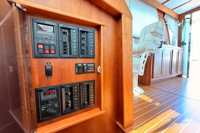 Slide: The Image of Electrical panel and helm seat inside 2022 Sabre 38 Salon Express yacht. - 33